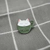 catffee-bila-kocicka-v-zelenem-hrnicku-1 Catffee - bílá kočička v zeleném hrníčku